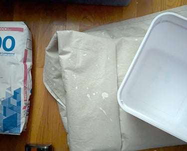 3D relief mural essentials to start; EasySand 90, large waterproof floor painting tarp, and a square bucket.