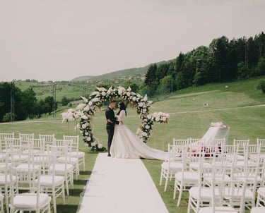 a bride and groom standing in front of a wedding ceremony