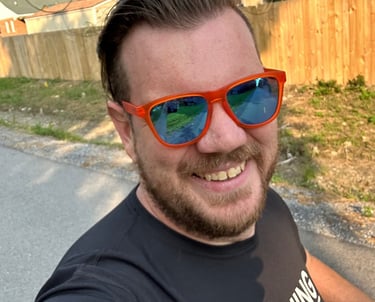 a man in sunglasses and sunglasses taking a selfie