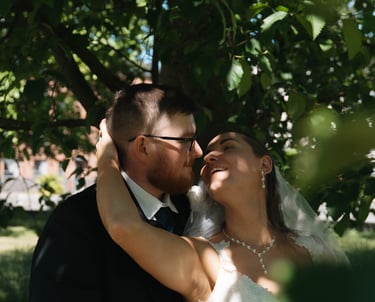 a bride and groom are posing for a photo