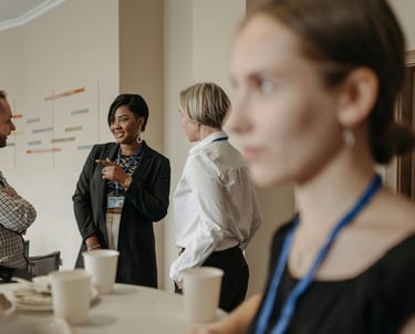a woman in a black dress shirt and a man in a suit