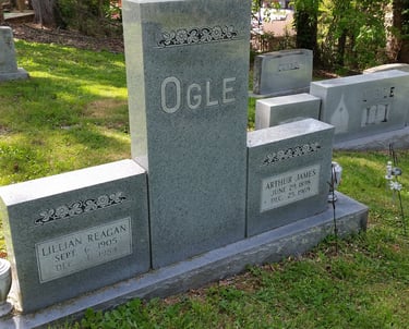 a group of tombstones with headstones and headstones