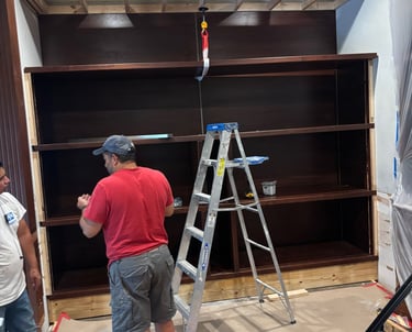 Professional carpenters working on custom made wall unit- Britto's Home Improvement