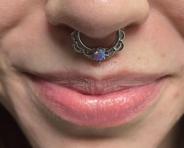 a woman with a septum piercing.