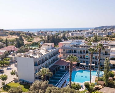 Aerial view of Dias Hotel in Crete featuring a swimming pool and sun deck with a coastal backdrop.