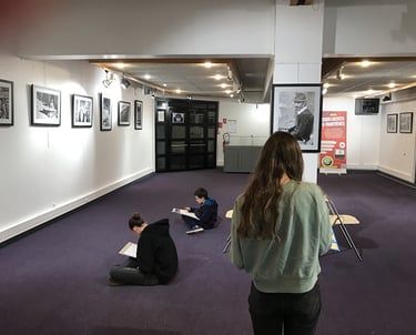 second photo of the art workshop students visiting the exhibition