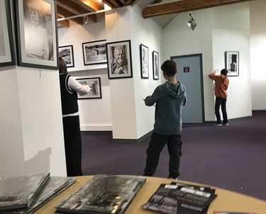 third photo of the art workshop students visiting the exhibition