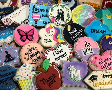Beautifully decorated cookies with royal icing designs for various occasions custom-made for birthdays, weddings, baby shower
