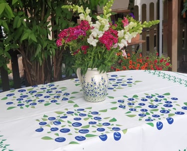 a vase with flowers in a vase on a table