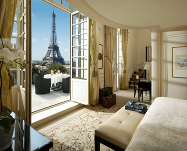 luxury bedroom with a view of the eiffel tower