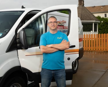 Dave standing in front of a service truck