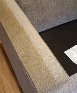 Nettoyage professionnel d’accoudoir de canapé gris en tissu par NetT à Toulouse