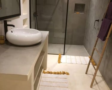 a bathroom with a sink and a ladder