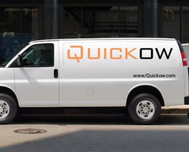 a man moving boxes into a truck