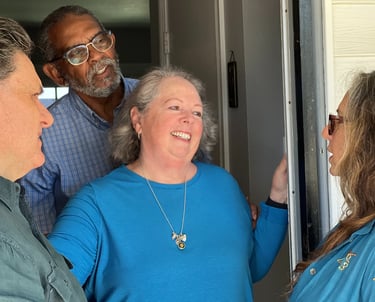 a group of people standing around a door