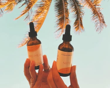 a person holding two bottles of vitamin - rich skin care products