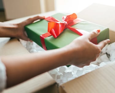 Lady is unboxing a Gift Box