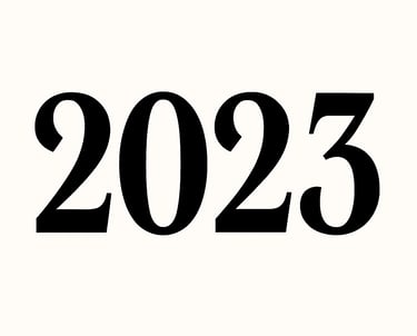 Bold black typography of the year 2023 set against a clean white background.