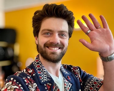 a man with a beard and a ring on his finger