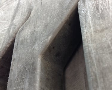 Rectangular massive metal shapes with angular spacing resembling pillars or elephants legs.