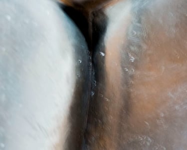 Closeup of three sliver-copper metal surfaces resembling women's closed tights and intimate spot.