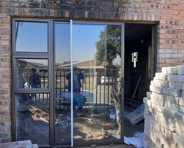 bronze aluminium door with sidelight and clear 6.38 shatterproof glass