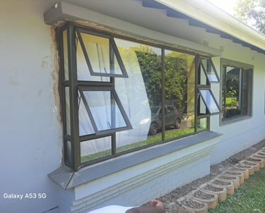 Aluminium window and door repair technician fixing a sliding door in Durban