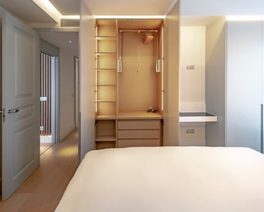 a bedroom with a bed and a closet
