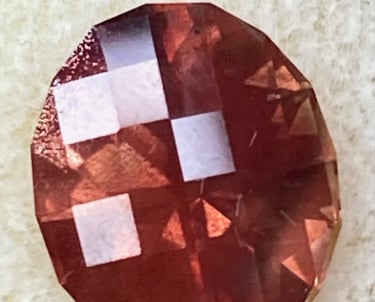 Sunstone with schiller in a checkerboard Oval