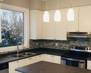 Image of a tile backsplash installation in kitchen
