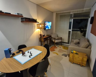 a dining room with a table and chairs