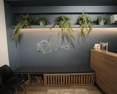 a desk with a desk and chairs in a room