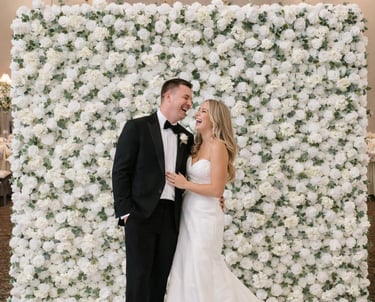 White elegant fabric flower wall with Happy Birthday neon sign rental in Minneapolis, MN