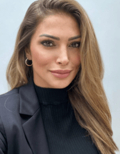 a woman with long hair and a black jacket
