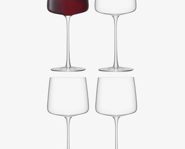 a group of wine glasses with wine glasses