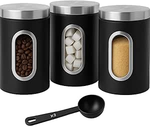 a set of three black canisteristers with coffee beans and coffee beans