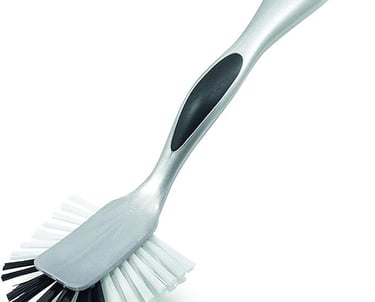 Addis metallic silver dish brush with scraper head and ergonomic non-slip handle.