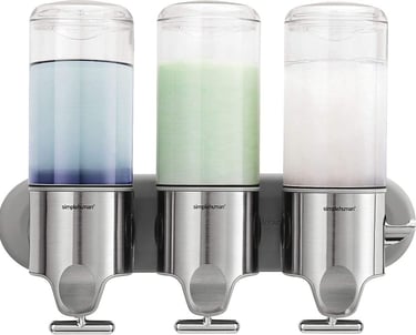 three soap dispensers with soap and soap