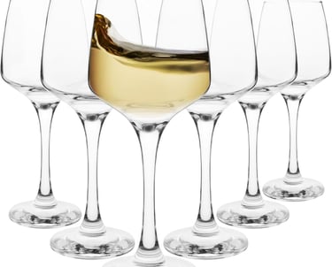 a wine glass filled with white wine