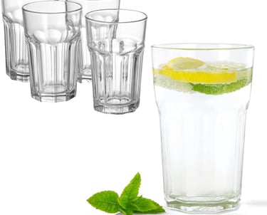 Set of clear faceted highball drinking glasses with one filled with lemon lime water and mint.