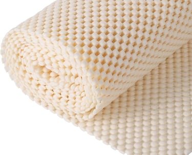 a close up of a mattress with a blanket on top