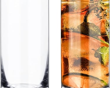 a glass of water with a slice of lemon on the side