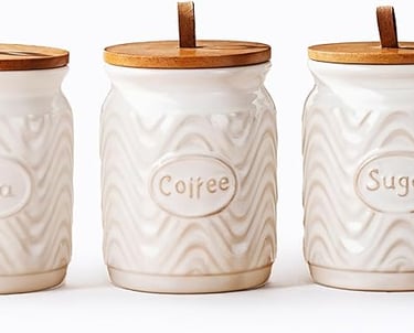 three jars with wooden lids and a wooden lid