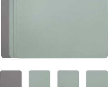 Set of sage green and grey faux leather placemats with a textured finish for dining table protection.