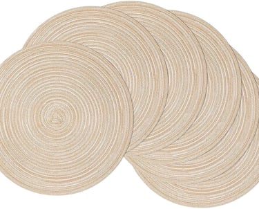 a set of four round placemats with a circular design