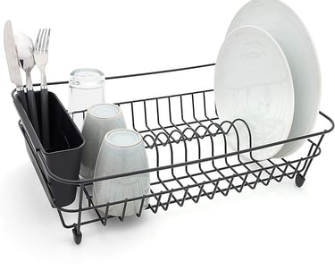 Black metal wire dish drying rack with utensil holder, plates, mugs, and silverware.