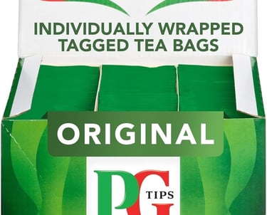 a box of tea bags with a green tea bag