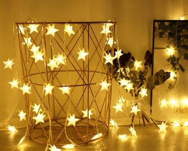 a room with a table and a vase with a star