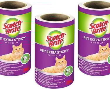 three rolls of cat litter paper on a roll of toilet paper