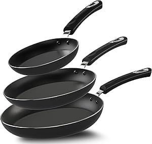 a group of four pans with black and white pans